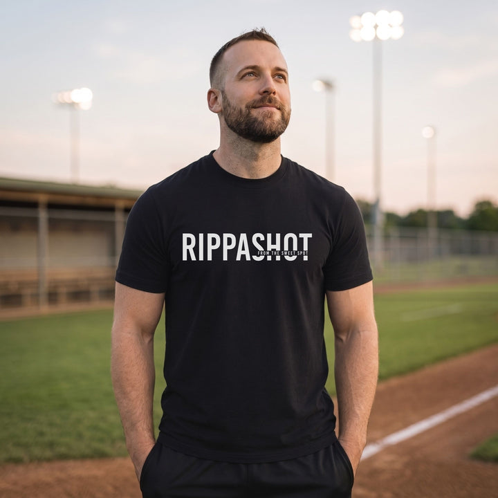A man wearing a black athletic t-shirt with &