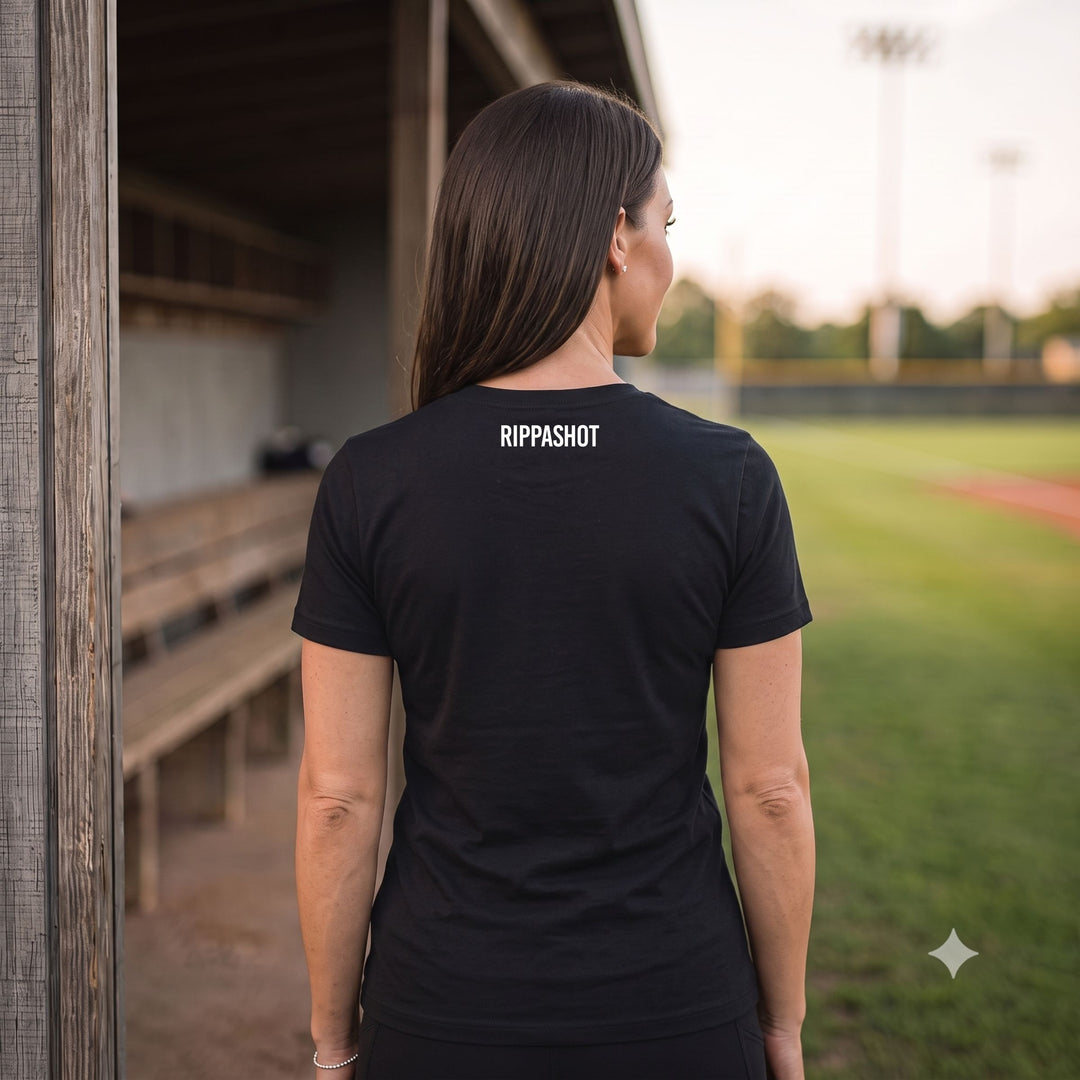 A woman viewed from behind wearing a black short-sleeve t-shirt with &