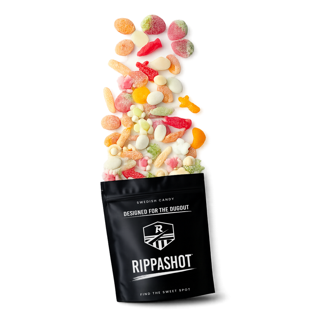 Black bag of Rippashot Swedish candy with colorful candies spilling out on a white background