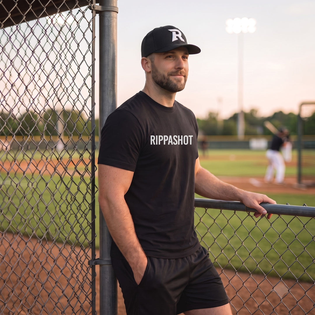A man wearing a black t-shirt with &